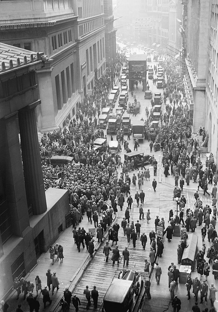 A solemn crowd gathers outside the Stock Exchange after the crash. 1929.