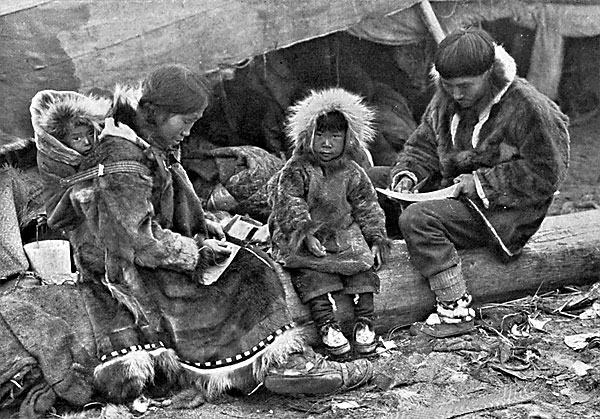 AN ESKIMO FAMILY.  Tenderness and responsibility in their treatment of children is a virtue of th...