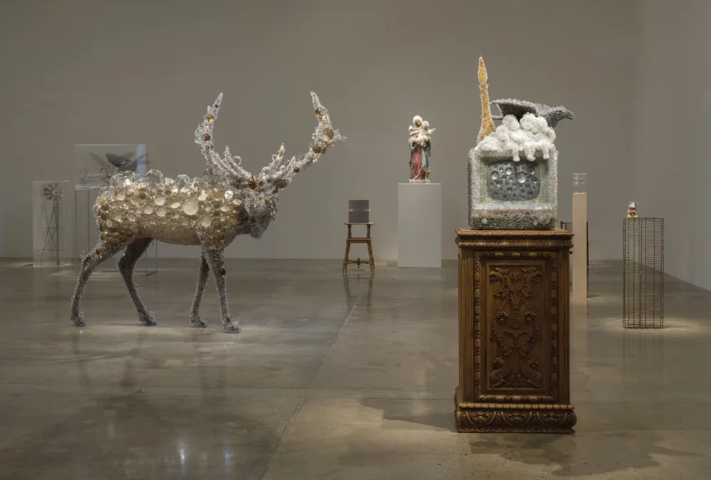Installation view of Kohei Nawa’s Photon Camp at Pace Gallery, Los Angeles. Works from the artist’s PixCell series—including a large elk sculpture covered in transparent lenses—are displayed alongside found objects and sculptural assemblages that explore perception, materiality, and transformation.