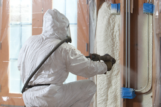 Trained Spray Foam Applicator Applying Open Cell Foam