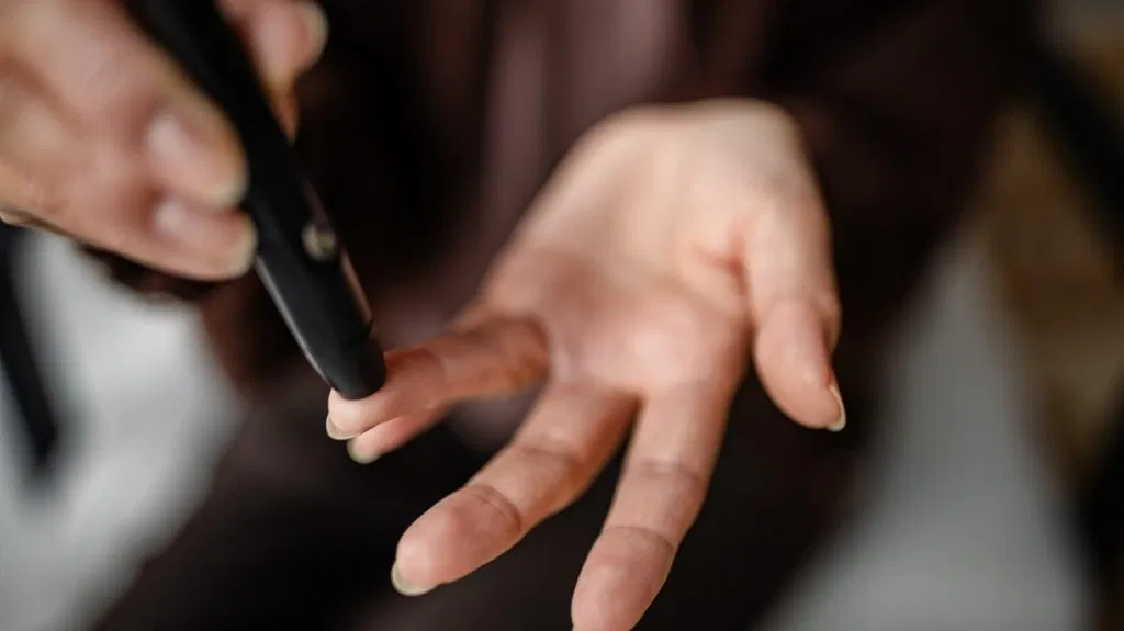A person checking their blood sugar levels.