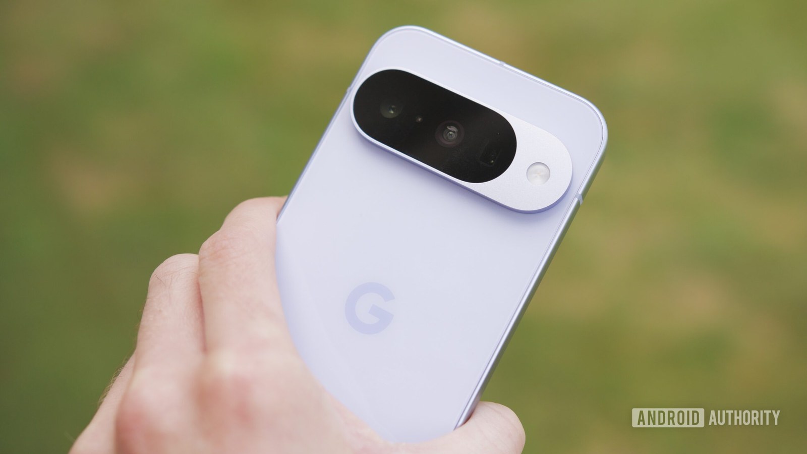 Someone holding the Google Pixel 10, showing the back of the phone.