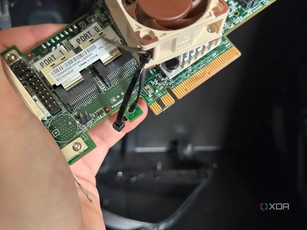A photo of an HBA card with some electrical tape across the pins