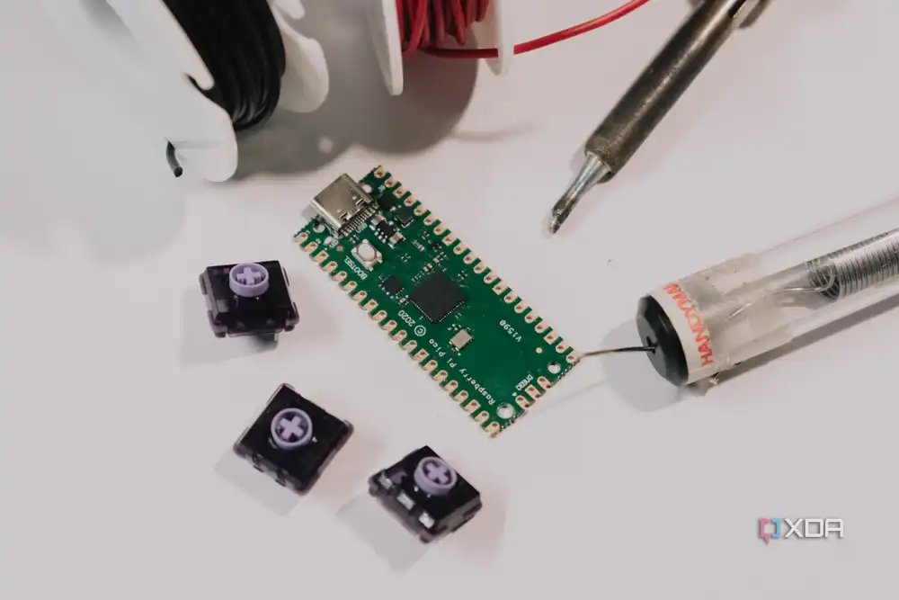 Raspberry Pi Pico clone surrounded by components and tools
