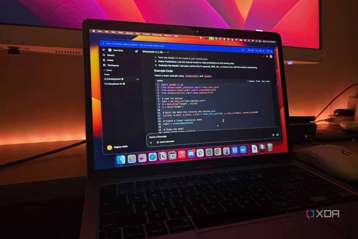 A MacBook air connected to a monitor running DeepSeek-R1 locally