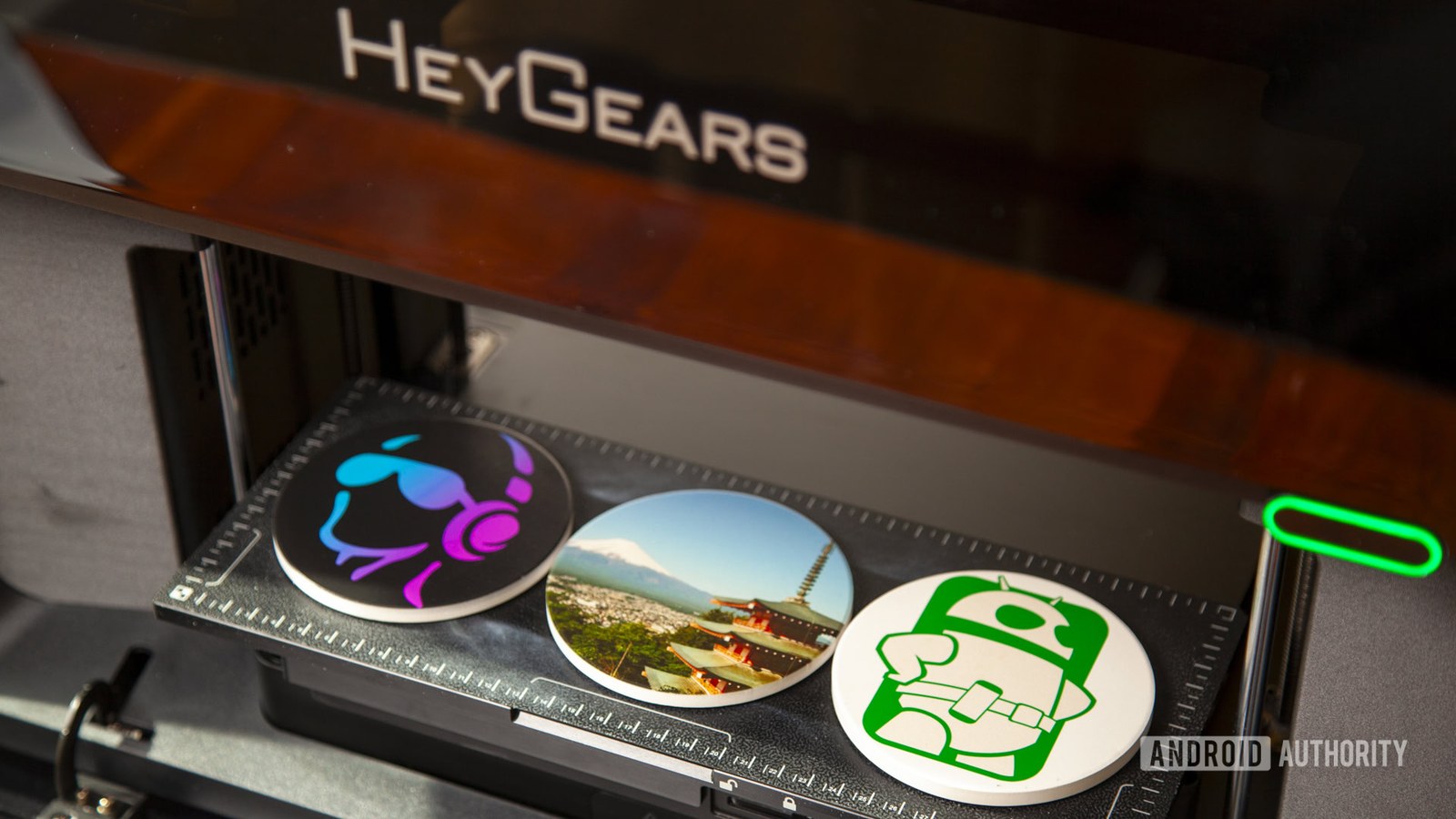 HeyGears G1X full-color 3D printer with completed coasters with 2D UV printed designs and photo