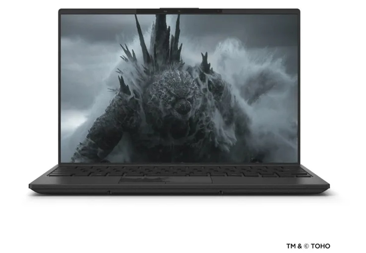 Fujitsu FMV Zero GODZILLA EDITION laptop viewed from the front with Godzilla wallpaper.