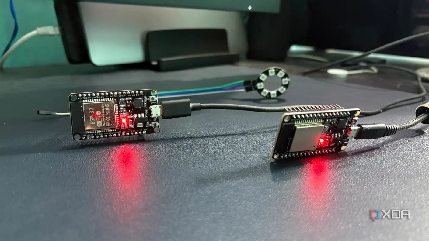 Two ESP32 boards on a desk with the LED ring dark