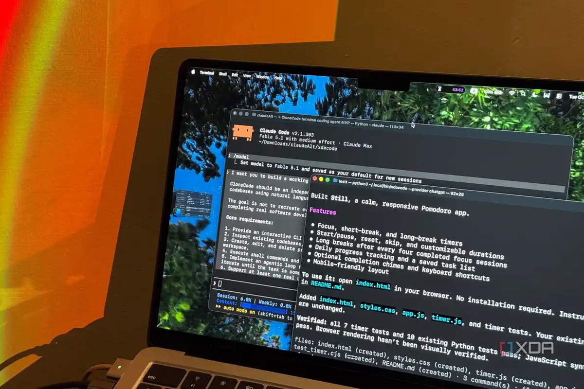 MacBook Air under orange lamp light showing Claude Code and the Still pomodoro summary