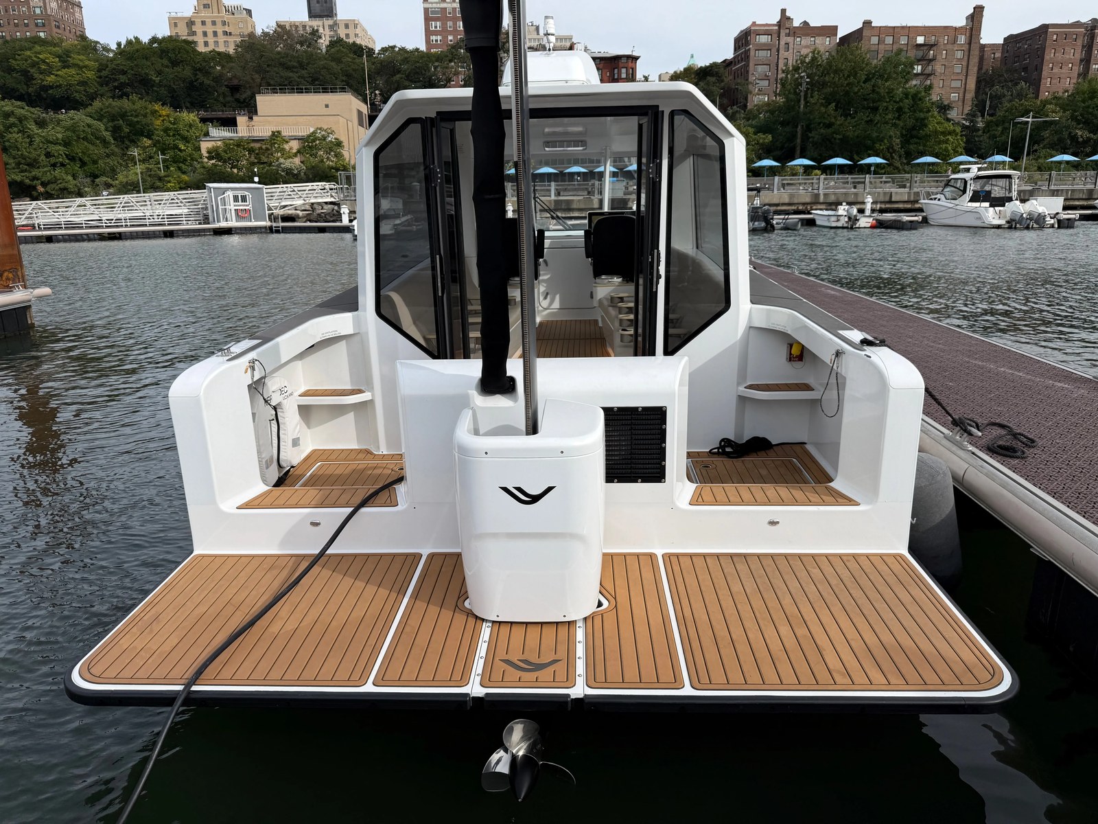 A hydrofoil ferry docked with its rear foil raised.