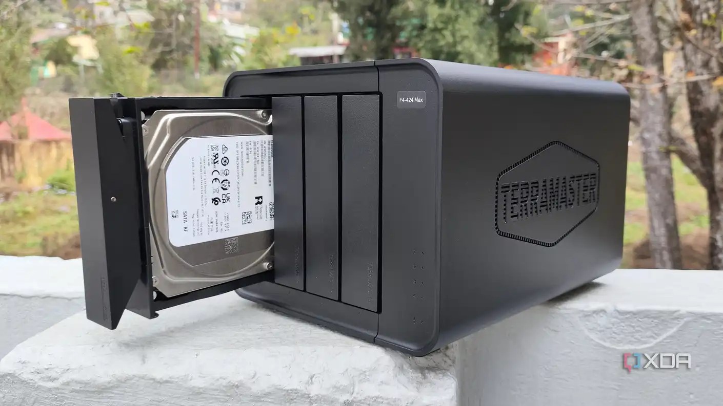 A person holding the TerraMaster F4-424 Max NAS