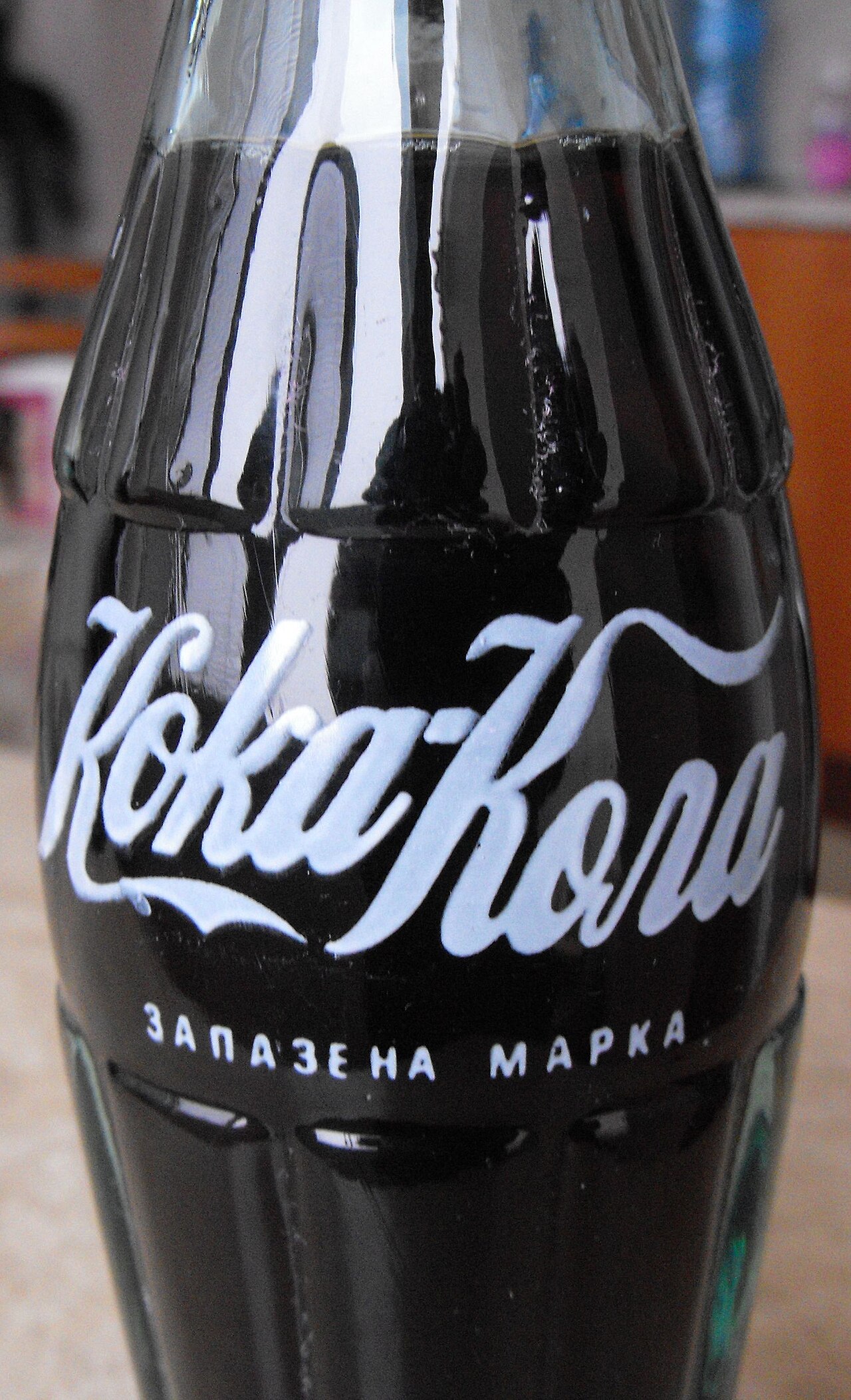 The Coca-Cola logo is identifiable in other writing-systems, here written in Cyrillic.